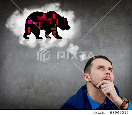 Thoughtful businessman looks on bear silhouette over head. Thoughtful businessman looks on bear silhouette over head. 63945012