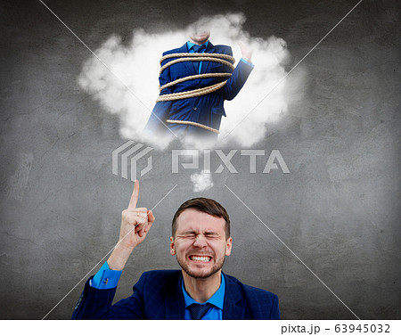 Angry businessman point finger on himself tide with a rope. 63945032