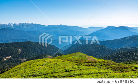 View over the Green Valley, surrounded by high mountains View over the Green Valley, surrounded by high mountains 63948360