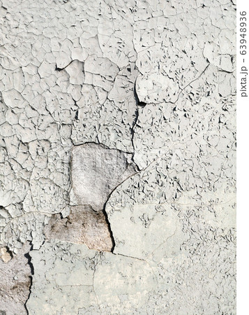 Stucco cracked on the wall as abstract background Stucco cracked on the wall as abstract background 63948936