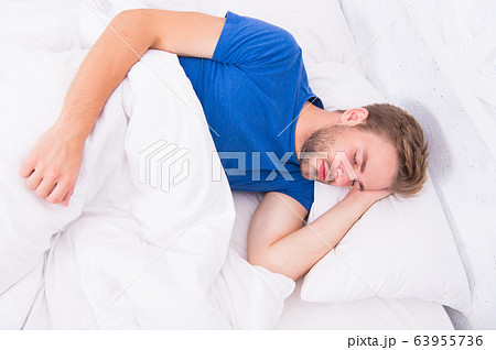 Seeing a dream. Sexy handsome man sleeping and Seeing a dream. Sexy handsome man sleeping and 63955736