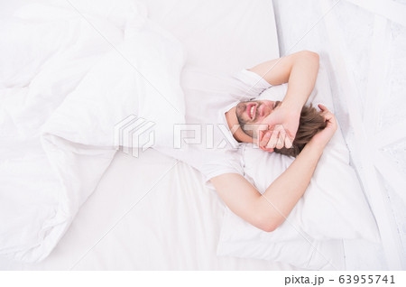 man sleeping white bedroom. cosy weekend at home. man sleeping white bedroom. cosy weekend at home. 63955741