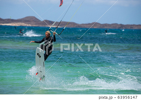 The kite surfer rides the waves of the Atlantic Ocean The kite surfer rides the waves of the Atlantic Ocean 63956147