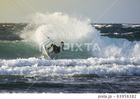The kite surfer rides the waves of the Atlantic Ocean 63956382