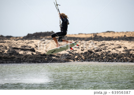 The kite surfer rides the waves of the Atlantic Ocean The kite surfer rides the waves of the Atlantic Ocean 63956387