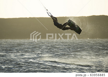 The kite surfer rides the waves of the Atlantic Ocean 63956885