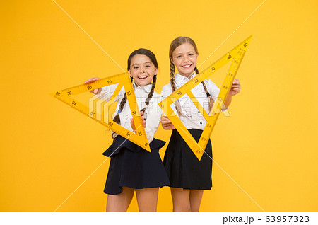 Pupil school girls big rulers. School knowledge. 63957323