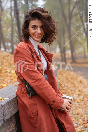 Cute smiling lady at the banister stock photo Cute smiling lady at the banister stock photo 63957412