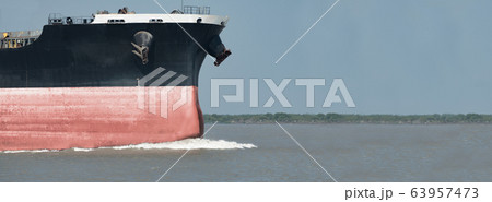 Close up of large red merchant crago ship in the 63957473