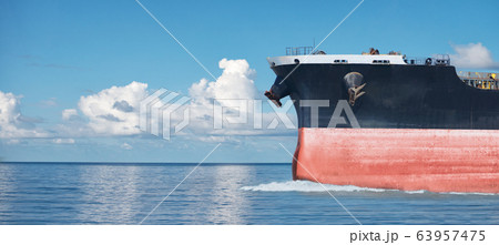 Close up of large red merchant crago ship in the Close up of large red merchant crago ship in the 63957475