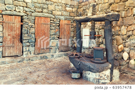 The old press for crushing olive oil The old press for crushing olive oil 63957478