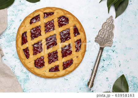 Delicious traditional berry cherry pie Crostata on light background 63958163