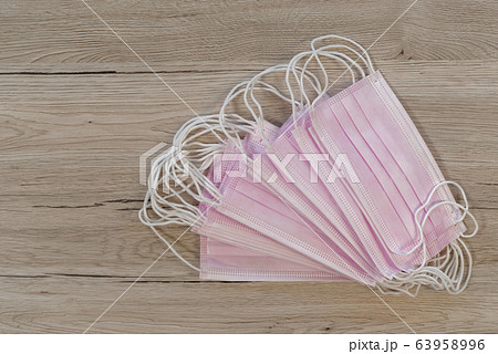 Many surgical masks with rubber ear straps 63958996