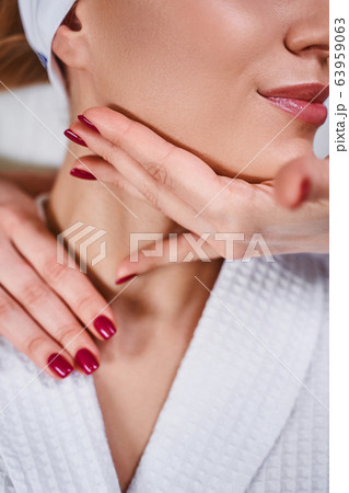 Cosmetologist is treating young woman stock photo 63959063