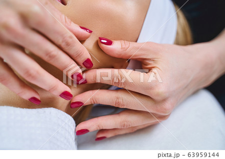 Beauty professional working with client stock photo Beauty professional working with client stock photo 63959144