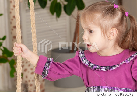 portrait of a three year old smiling little girl 63959175