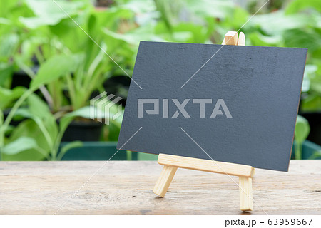 Blank black board on wooden plank for Blank black board on wooden plank for 63959667