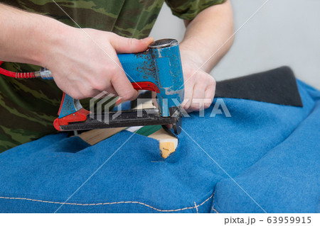 manufacture of upholstered furniture, furniture upholstery with a pneumatic stapler 63959915