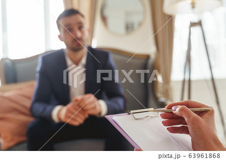 Modern young man at a therapy session 63961868