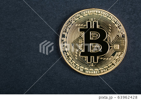 coin bitcoin close-up on a dark background coin bitcoin close-up on a dark background 63962428