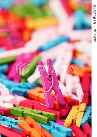 Small Clothespins of different colors close-up as Small Clothespins of different colors close-up as 63962548