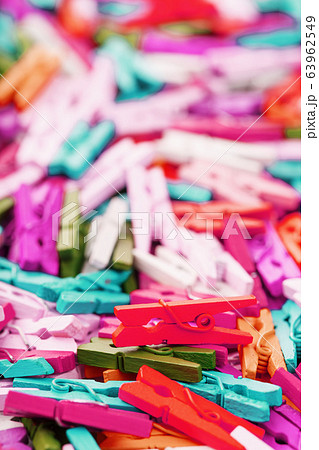 Colorful Wooden clothespins close-up as texture 63962549