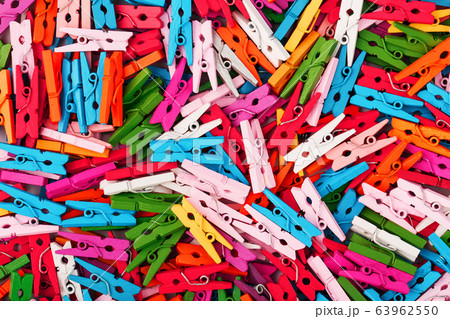 Small multi-colored clothespins as a full-screen Small multi-colored clothespins as a full-screen 63962550