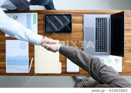 Men shaking hands Men shaking hands 63963865