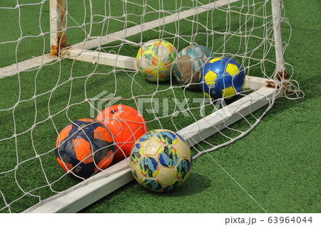 サッカーボールとゴールネットの写真素材