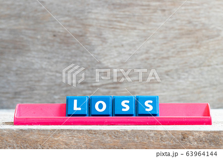 Tile letter on red rack in word lose on wood background Tile letter on red rack in word lose on wood background 63964144
