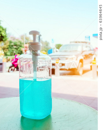 Antiseptic hand gel or alcohol gel prevent the spread of germs and bacteria and avoid infections corona virus,covid-19 prevention for serving customers in the gas station. 63964645