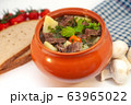 Roast in a pot with beef meat and potatoes on the table 63965022