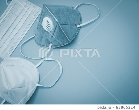 A variety of masks are placed on a gray background A variety of masks are placed on a gray background 63965214