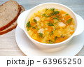 Chicken soup with meatballs and pasta on the table 63965250