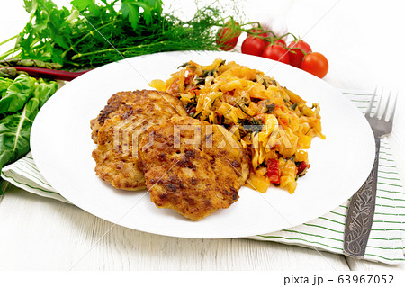 Fritters meat with cabbage in plate on wooden Fritters meat with cabbage in plate on wooden 63967052