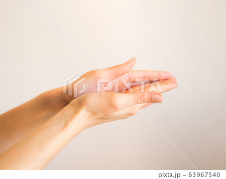 Female hands cleaning with sanitizer gel Female hands cleaning with sanitizer gel 63967540