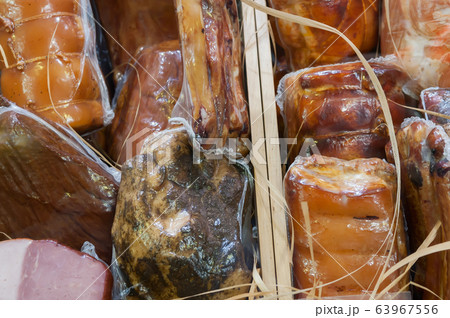 Bacon in assortment on a supermarket window. 63967556