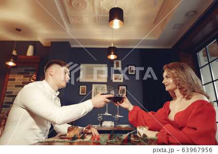 Elegant couple spend time in a restaurant 63967956