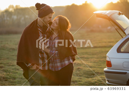 Beautiful couple spend time on a sunset park 63969331