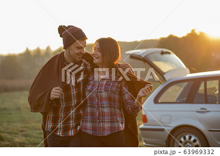 Beautiful couple spend time on a sunset park 63969332