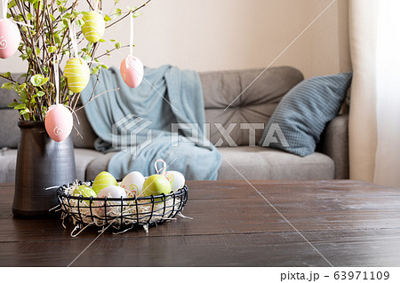 Spring home interior with Easter tree and eggs 63971109