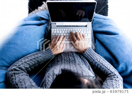 Top view woman using laptop for business online 63979175