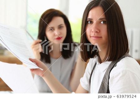 Beautiful smiling businesswoman portrait at workplace Beautiful smiling businesswoman portrait at workplace 63979524