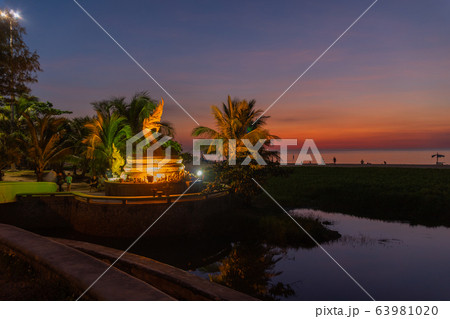 sunset at golden dragon statue on Karon beach 63981020