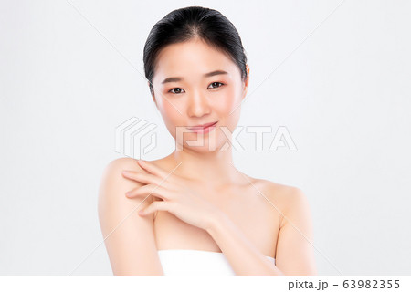 Beautiful Young Asian Woman with Clean Fresh Skin. Face care, Facial treatment, Cosmetology, beauty Beautiful Young Asian Woman with Clean Fresh Skin. Face care, Facial treatment, Cosmetology, beauty 63982355