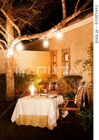 Luxury African Safari lodge outdoor dining in garden Luxury African Safari lodge outdoor dining in garden 63985841