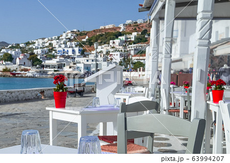 Outdoor restaurant with sea view. Greece vacation Outdoor restaurant with sea view. Greece vacation 63994207