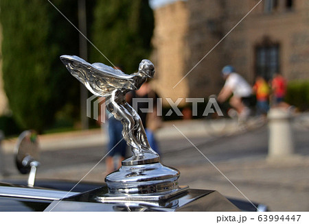Car emblem made with the figure of a woman with wings in take-off position to fly Car emblem made with the figure of a woman with wings in take-off position to fly 63994447