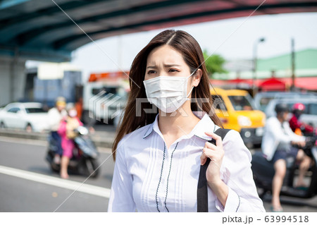 Asian woman with facial mask 63994518