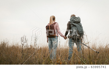Couple Of Treveler Standing Outdoors 63995741